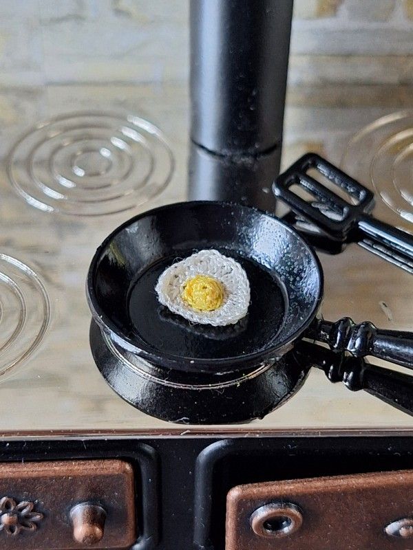 Micro crochet fried egg in a miniature frying pan
